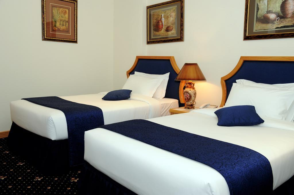 Cayam Hotel Doha Szoba fotó
